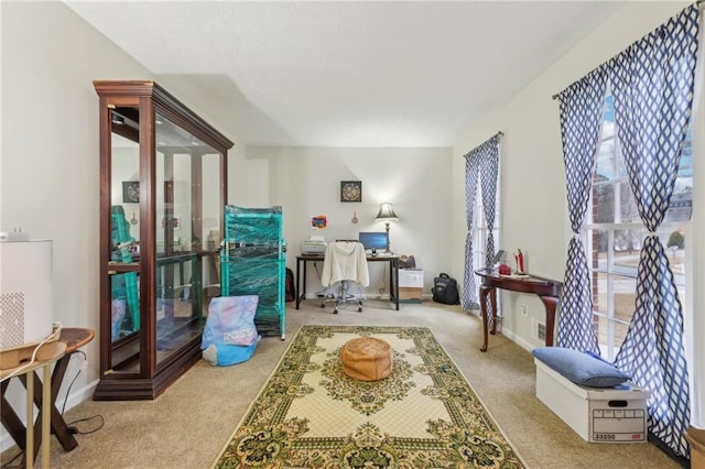 sitting room featuring a healthy amount of sunlight and light colored carpet