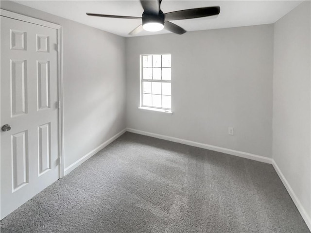 empty room featuring carpet floors and ceiling fan