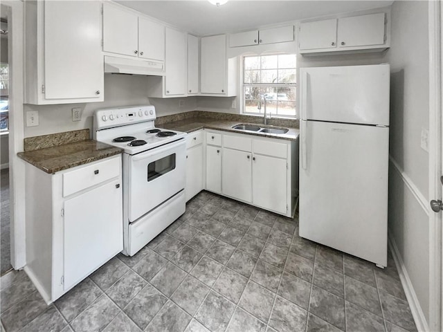 kitchen with white appliances, sink, and white cabinets