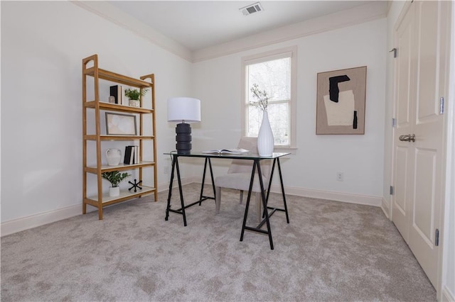 carpeted office space with baseboards, visible vents, and ornamental molding