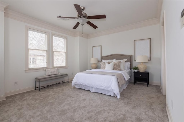 bedroom with light colored carpet, a ceiling fan, baseboards, and ornamental molding