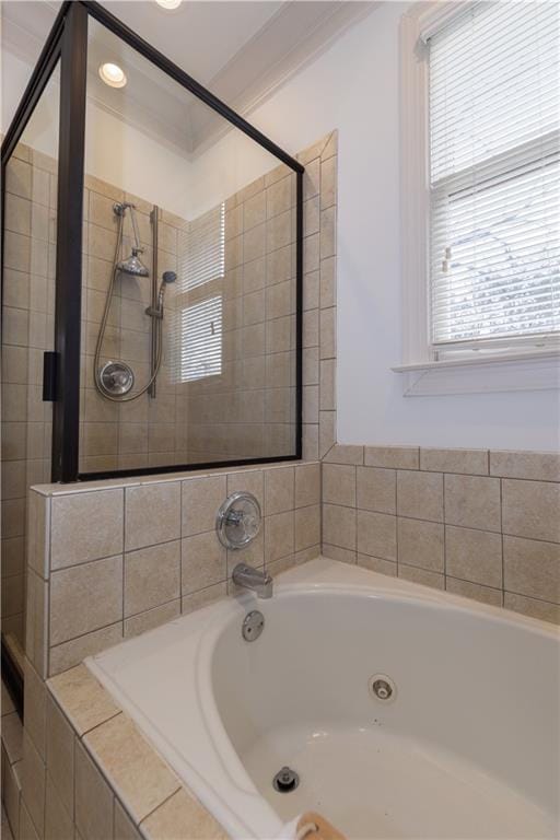 full bathroom with a bath, a tile shower, and ornamental molding