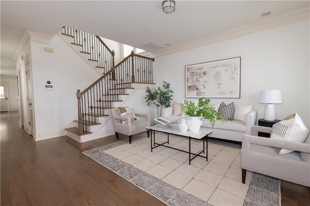 living room with wood-type flooring and crown molding