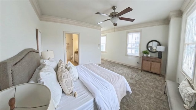 carpeted bedroom featuring connected bathroom, a ceiling fan, baseboards, and ornamental molding