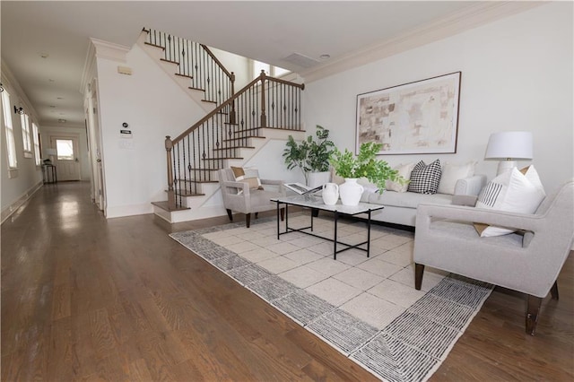 living room featuring stairway, crown molding, baseboards, and wood finished floors