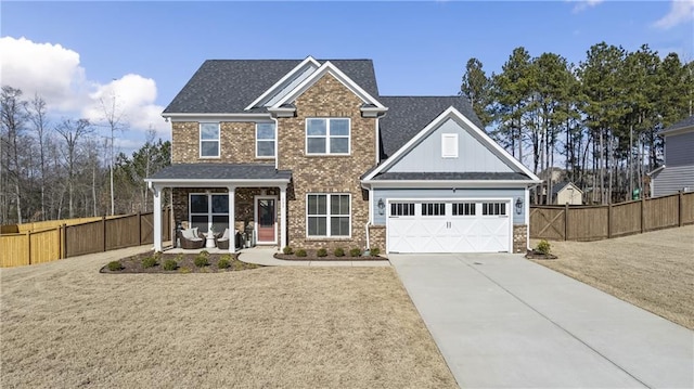 craftsman-style house with a garage and a front yard