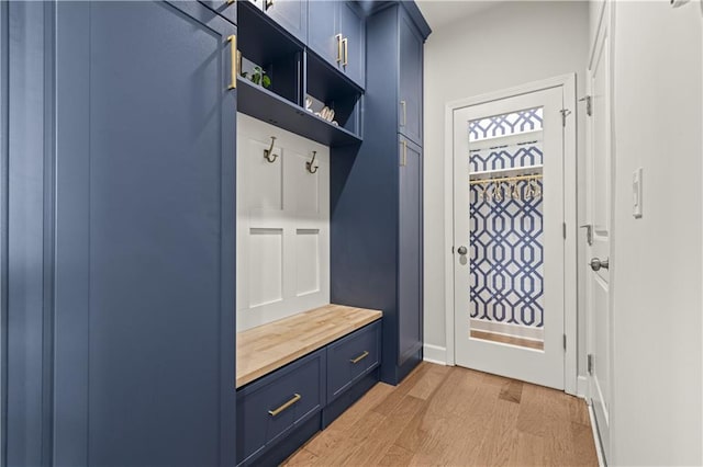 mudroom with light hardwood / wood-style flooring