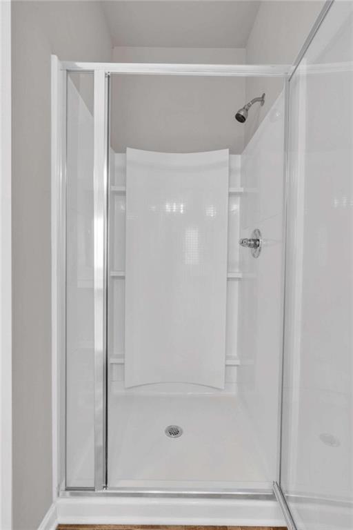 bathroom featuring walk in shower