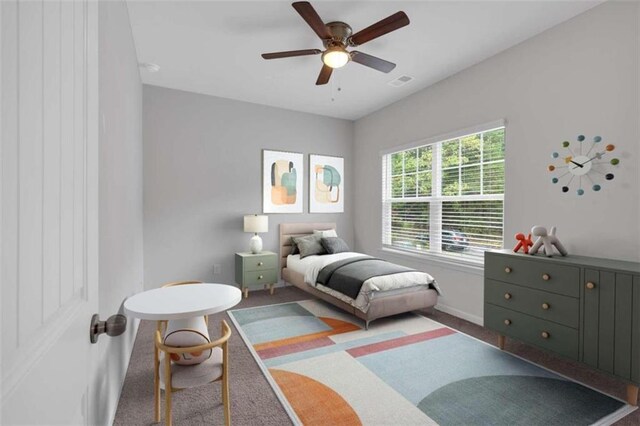 carpeted bedroom featuring ceiling fan