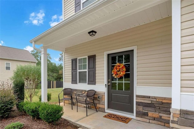 entrance to property featuring a patio