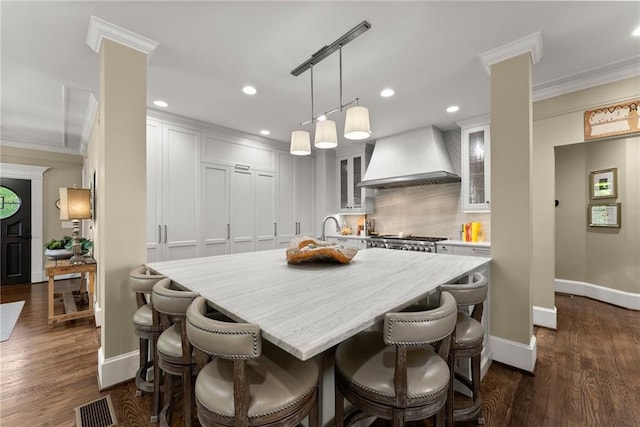 1539 Berkeley Ct, Gainesville, GA 30501 - dining room with crown molding, recessed lighting, baseboards, dark wood finished floors, and decorative columns