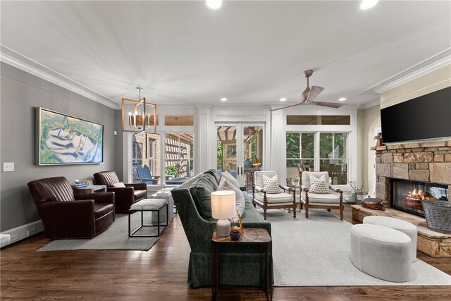 1539 Berkeley Ct, Gainesville, GA 30501 - living area with crown molding, a stone fireplace, recessed lighting, wood finished floors, and a ceiling fan