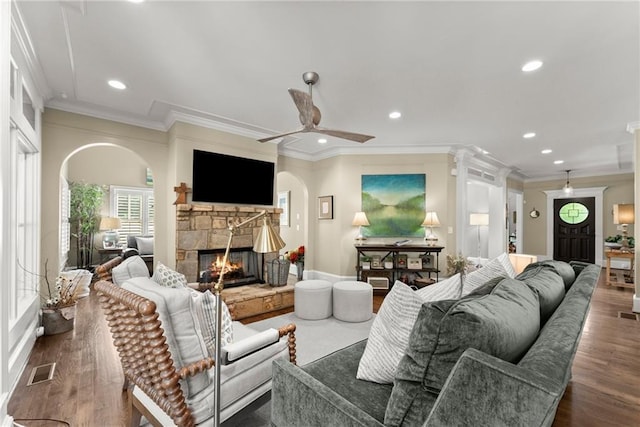 1539 Berkeley Ct, Gainesville, GA 30501 - living area featuring crown molding, arched walkways, a fireplace, recessed lighting, and ceiling fan