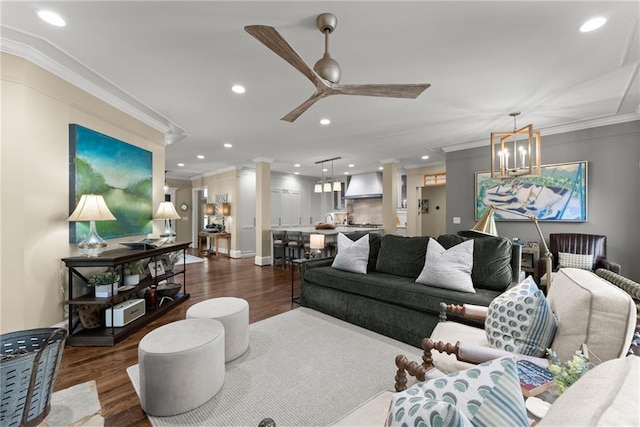 1539 Berkeley Ct, Gainesville, GA 30501 - living room with crown molding, dark wood-style flooring, recessed lighting, a ceiling fan, and ornate columns