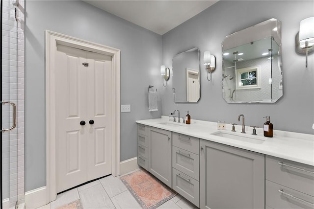 1539 Berkeley Ct, Gainesville, GA 30501 - bathroom featuring double vanity, a stall shower, baseboards, and tile patterned floors