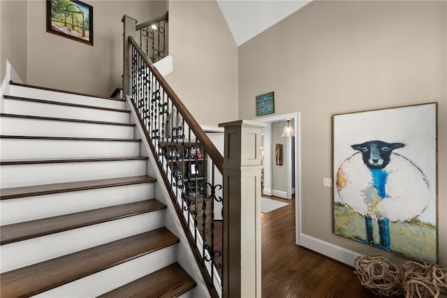 1539 Berkeley Ct, Gainesville, GA 30501 - stairway with high vaulted ceiling, wood finished floors, and baseboards