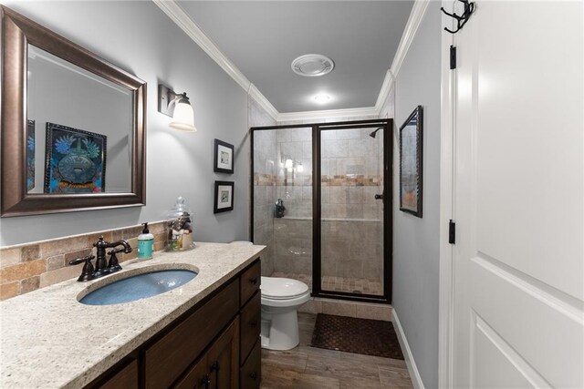 1539 Berkeley Ct, Gainesville, GA 30501 - full bathroom with toilet, vanity, a shower stall, ornamental molding, and wood finished floors