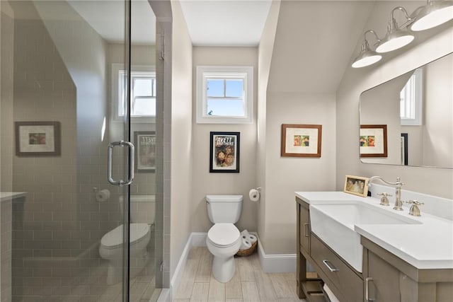1539 Berkeley Ct, Gainesville, GA 30501 - bathroom with toilet, vanity, baseboards, a shower stall, and wood finished floors
