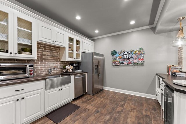 1539 Berkeley Ct, Gainesville, GA 30501 - kitchen with stainless steel appliances, a sink, dark countertops, wine cooler, and baseboards