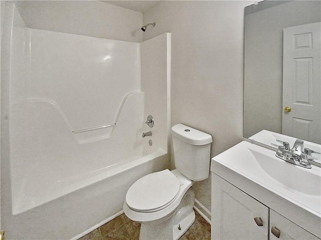 full bathroom featuring tile patterned floors, bathing tub / shower combination, vanity, and toilet