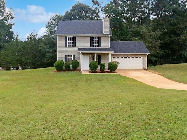 colonial house with a garage and a front yard