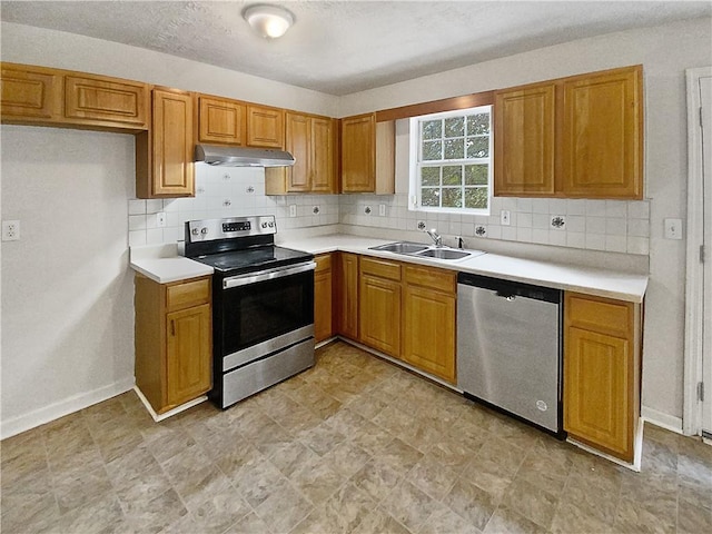 kitchen featuring decorative backsplash, sink, and stainless steel appliances