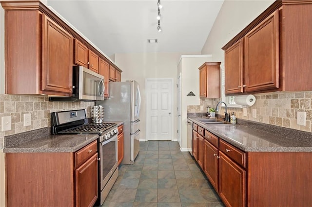 2125 Mina Lane Dr, Buford, GA 30518 - kitchen with stainless steel appliances, a sink, backsplash, and brown cabinetry
