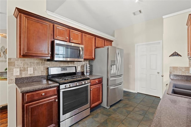 2125 Mina Lane Dr, Buford, GA 30518 - kitchen featuring stainless steel appliances, decorative backsplash, dark countertops, crown molding, and brown cabinets