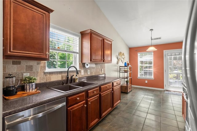 2125 Mina Lane Dr, Buford, GA 30518 - kitchen with stainless steel appliances, a sink, vaulted ceiling, dark countertops, and backsplash