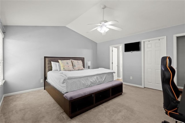 2125 Mina Lane Dr, Buford, GA 30518 - bedroom with vaulted ceiling, carpet flooring, baseboards, and a ceiling fan