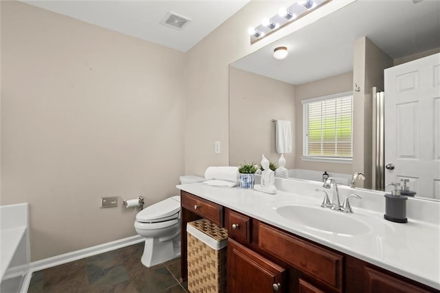 2125 Mina Lane Dr, Buford, GA 30518 - bathroom with toilet, baseboards, vanity, and a bathtub