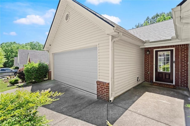 2125 Mina Lane Dr, Buford, GA 30518 - entrance to property featuring brick siding, an attached garage, a shingled roof, and concrete driveway