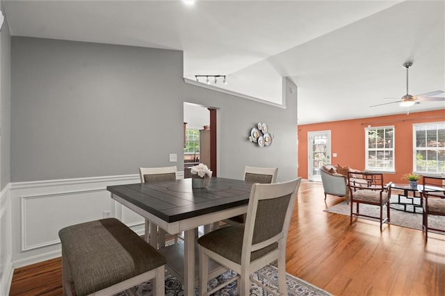 2125 Mina Lane Dr, Buford, GA 30518 - dining room with lofted ceiling, wood finished floors, wainscoting, and ceiling fan