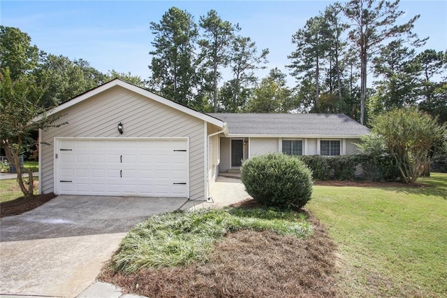 ranch-style house with concrete driveway, an attached garage, and a front yard