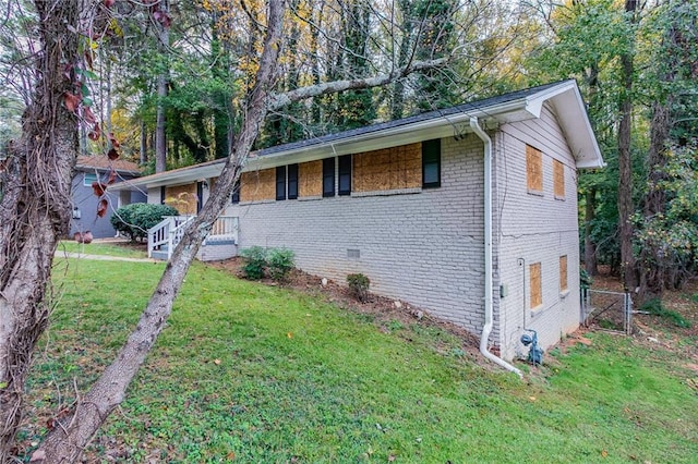 ranch-style home with a front lawn