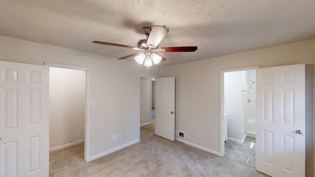 3359 Mansfield Ln, Snellville, GA 30039 - unfurnished bedroom featuring baseboards, a textured ceiling, light carpet, and ensuite bath