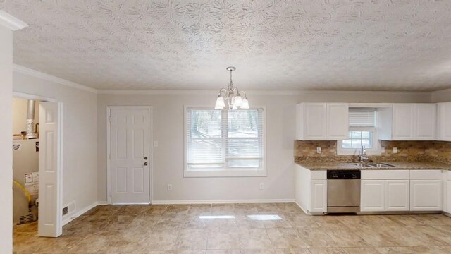 3359 Mansfield Ln, Snellville, GA 30039 - kitchen with a sink, white cabinetry, an inviting chandelier, light stone countertops, and dishwasher