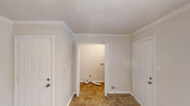 3359 Mansfield Ln, Snellville, GA 30039 - interior space with visible vents, a textured ceiling, crown molding, and baseboards