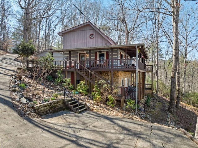 193 Alm Ln, Ellijay, GA 30540 - chalet / cabin featuring stairs, ceiling fan, stone siding, and a deck