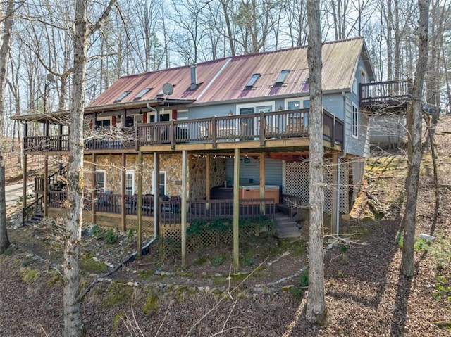 193 Alm Ln, Ellijay, GA 30540 - back of property with a jacuzzi, a wooden deck, and metal roof