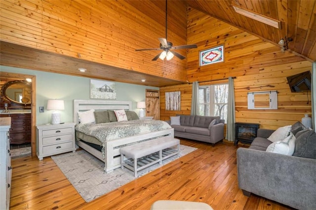 193 Alm Ln, Ellijay, GA 30540 - bedroom featuring high vaulted ceiling, wood walls, light wood-style flooring, and wooden ceiling
