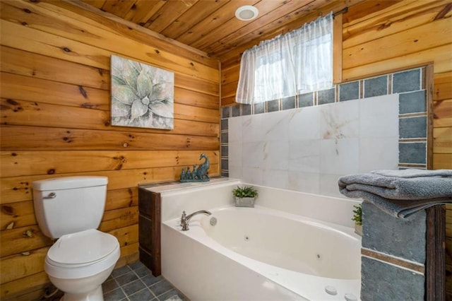 193 Alm Ln, Ellijay, GA 30540 - full bath with toilet, a tub with jets, wood ceiling, tile patterned floors, and wooden walls