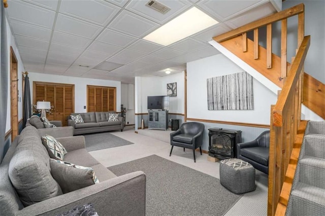 193 Alm Ln, Ellijay, GA 30540 - carpeted living area with a wood stove and stairway