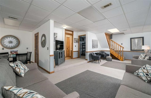 193 Alm Ln, Ellijay, GA 30540 - carpeted living area with stairs, a paneled ceiling, and baseboards