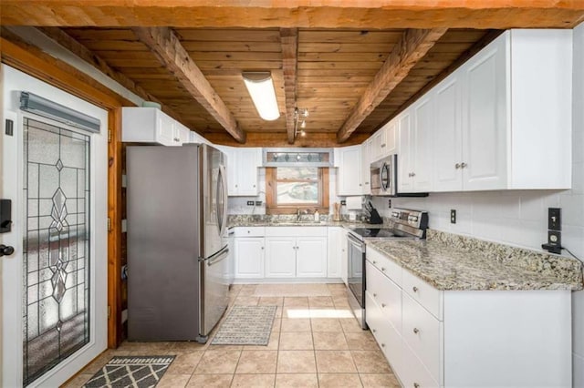 193 Alm Ln, Ellijay, GA 30540 - kitchen with stainless steel appliances, wooden ceiling with exposed beams, white cabinets, light stone countertops, and a sink
