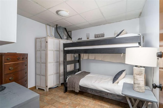 193 Alm Ln, Ellijay, GA 30540 - bedroom featuring a drop ceiling and stone finish flooring