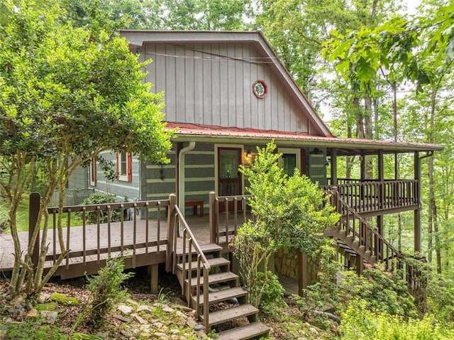 193 Alm Ln, Ellijay, GA 30540 - view of front facade featuring stairs, a wooden deck, and metal roof