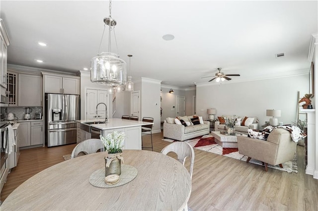 2860 Windsor Knoll Dr, Dacula, GA 30019 - dining space featuring a ceiling fan, dark wood finished floors, crown molding, and recessed lighting