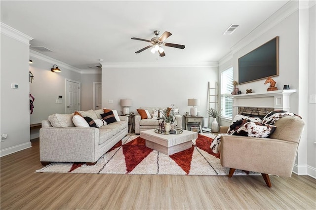 2860 Windsor Knoll Dr, Dacula, GA 30019 - living area featuring wood finished floors, ceiling fan, crown molding, and a stone fireplace