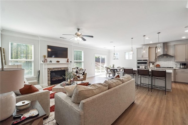 2860 Windsor Knoll Dr, Dacula, GA 30019 - living room featuring ornamental molding, ceiling fan, light wood-style floors, plenty of natural light, and recessed lighting